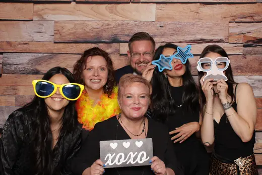 Three guests with prop mustaches and a CENSORED sign